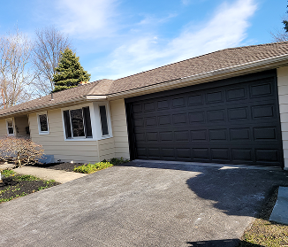Residential garage exterior with freshly painted doors