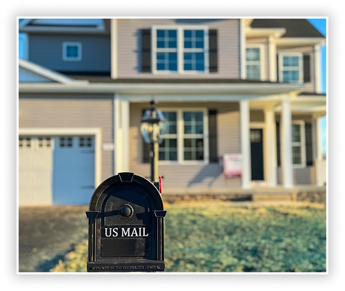 New residential home with front yard and mailbox